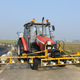 Illustration for article titled This Weedseeking Airport Tractor Spells Death for Dandelions